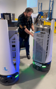 Man scanning an item for a Locus Robot