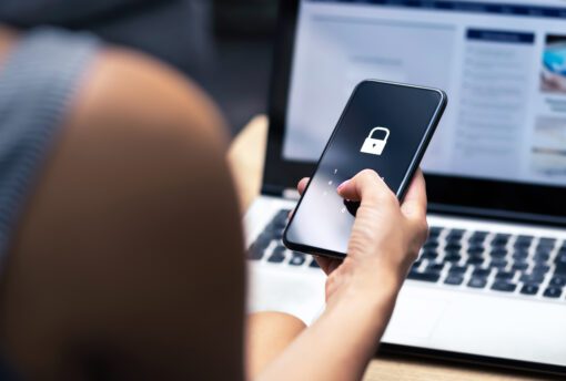 Woman holding phone with a lock screen