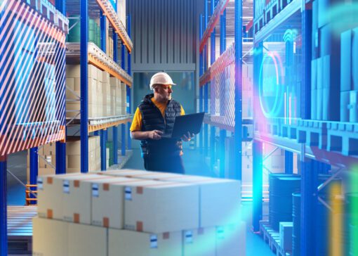 Man in warehouse looking at automation