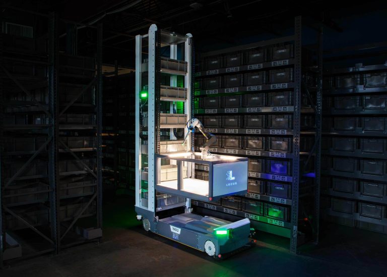 Locus Array robot with a robotic arm picking from storage totes on tall warehouse shelving