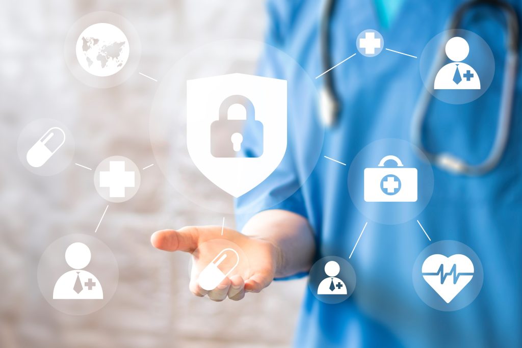 Healthcare worker in scrubs with a digital padlock shield icon linked to medical and security symbols