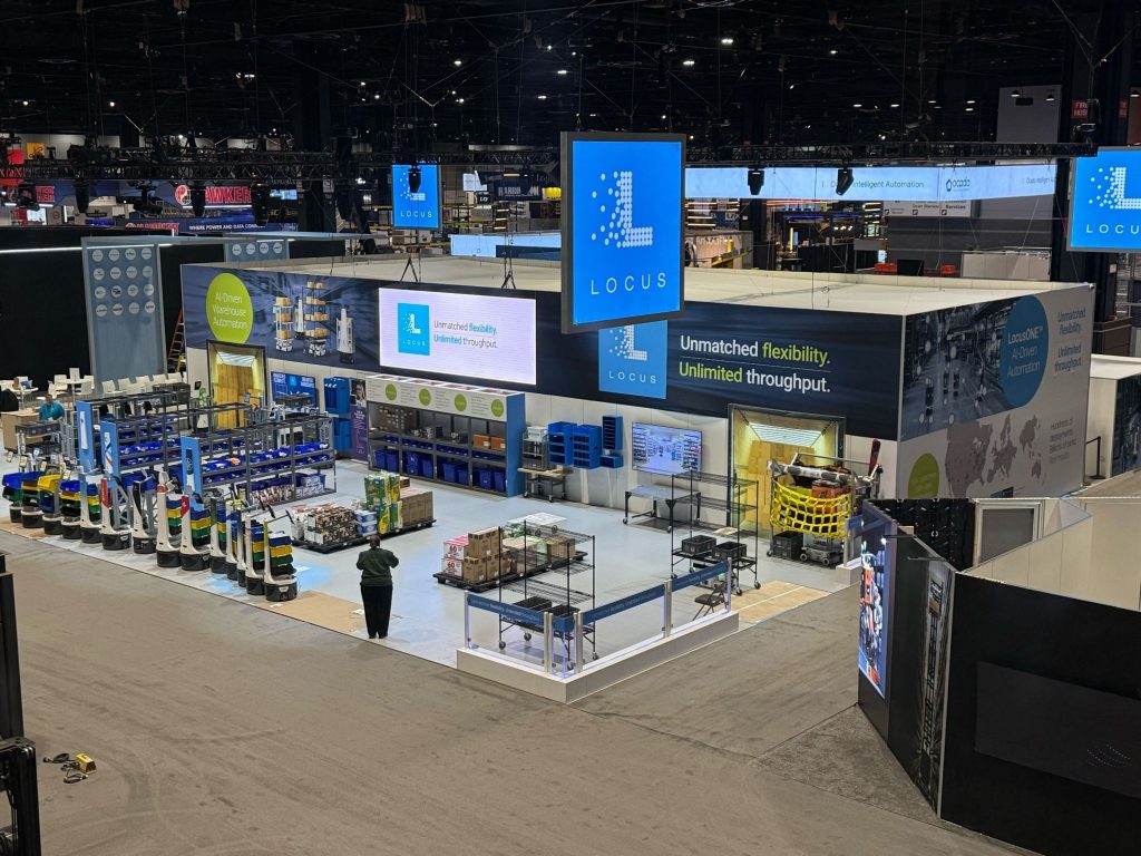 Locus Robotics booth at ProMat 2025 with LocusBots and signs reading Unmatched flexibility, Unlimited throughput