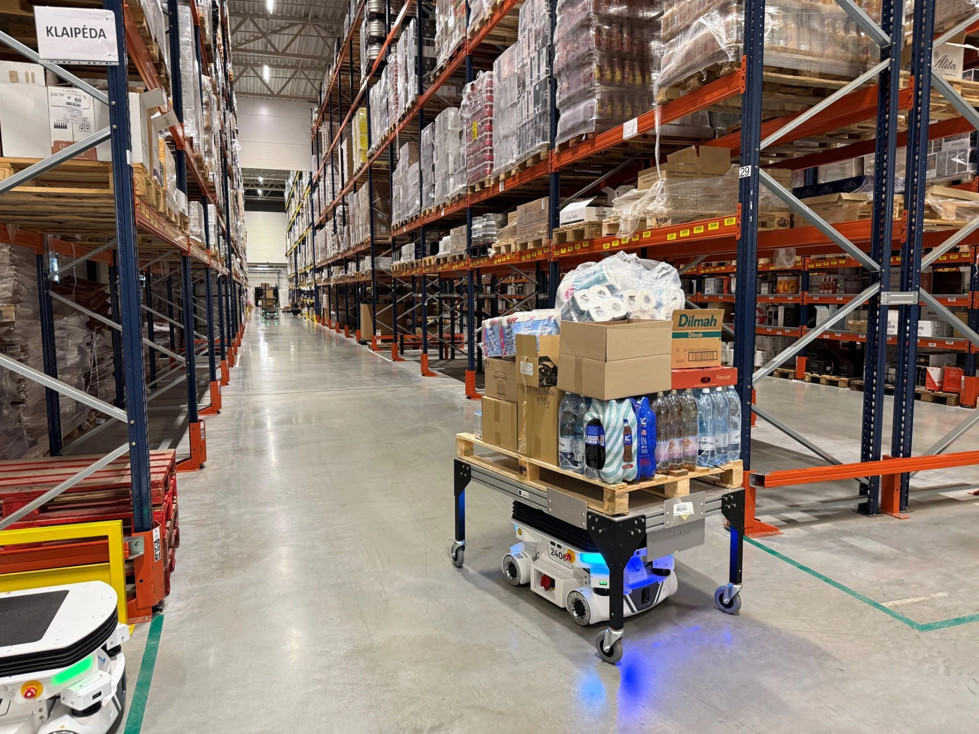 Locus Vector alongside associates on the warehouse floor